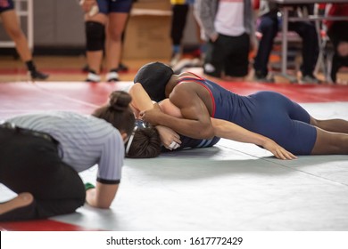 High School Wrestlers Competing At A Wrestling Meet