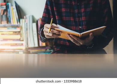 High School,college,university Student Writing In Classroom Or Library At Work Space With Book Stack For Knowledge Prepare Exams Scholarship Study Abroad.research World International Education Learn