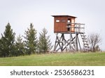 High seat for hunters and gamekeepers in the nature. Nature of Czech republic.