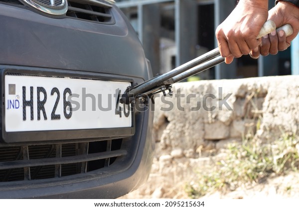 High Security Number Plate Electronically Linked To\
Vehicle Is Mandated By Central Government Of India. Fitting Snap On\
Locks For HSRP With IND And Chromium Ashoka Chakra Using Riveter\
Gun Tool