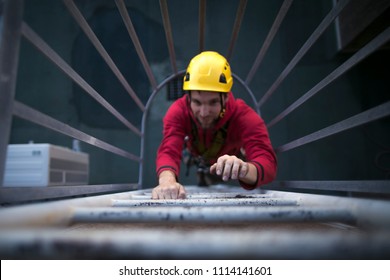 High Shoot Picture Of Male Hand Industry Rope Access Worker Wearing Full Safety Harness, Helmet Climbing Safety Ladder With Blurry Face Back Ground At Construction Site In Sydney City, Australia 