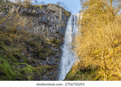 A high shutter speed image of the top section of the Pistyll Rhaeadr waterfall in Wales, UK freezing the water spray droplets