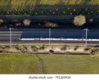 High Speed Electric Passenger Train In Countryside Top Down Aerial View