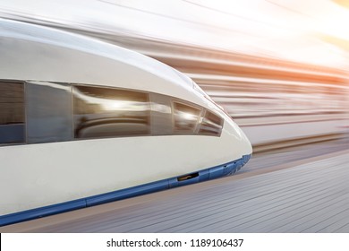 High Speed Fast Train Passenger Locomotive In Motion At The Railway Station