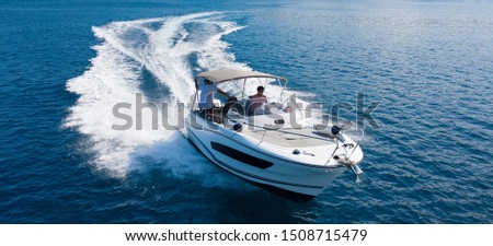High speed motor boat on open sea. Travel, transportation and leasure activities