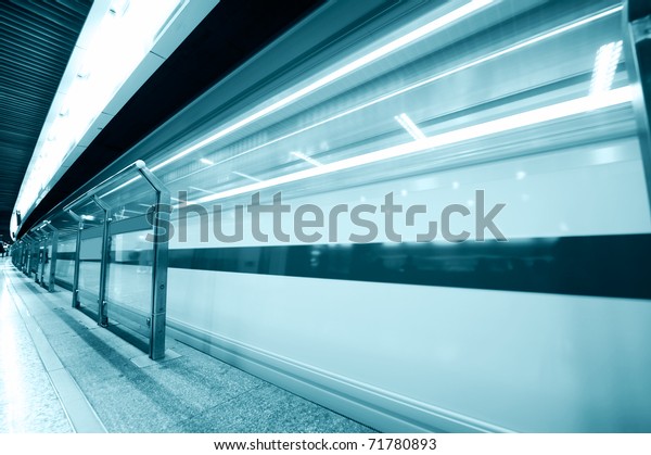high speed moving train in subway station. Black\
& white image