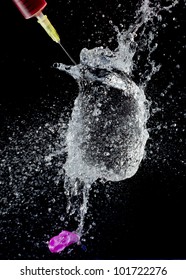 High Speed Photo Of A Water Filled Balloon Bursting