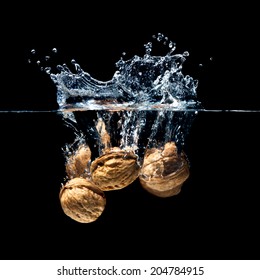 High Speed Photography Walnuts Splash In Water