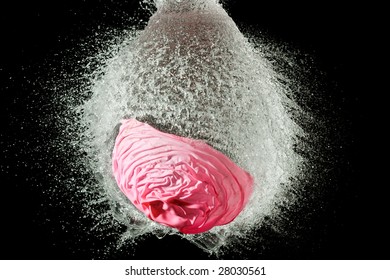 High Speed Time Freeze Photo Of Baloon Filled With Water Explode