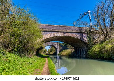 High Speed Train Bridges Span The Oxford Canal Near Hillmorton, Warwickshire, UK On A Bright Spring Day