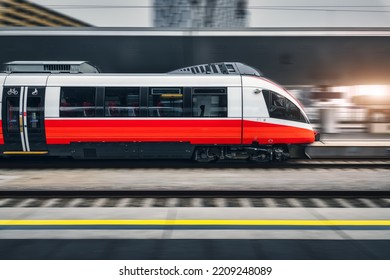 High Speed Train In Motion Inside Modern Train Station In Vienna. Fast Red Intercity Passenger Train With Motion Blur Effect. Railway Platform. Railroad In Europe. Commercial Transportation. Transport