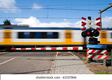 High Speed Train Passing A Railway Crossing