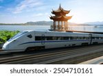 High speed trains travel on West Lake in Hangzhou, China