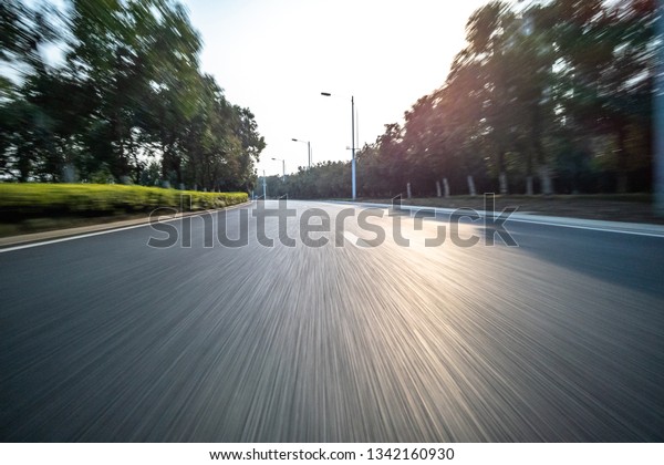 high speed view of\
asphalt road in city
