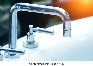 high spout faucet in front on sink