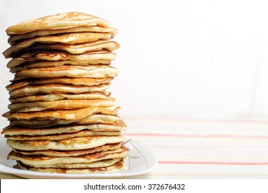 High stack of pancakes . Breakfast for the whole family . With copy space. Shallow DOF