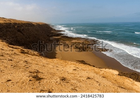 High, steep cliffs of the Atlantic Ocean coast near Chbika, Guelmim-Oued Noun region. Morocco, Africa