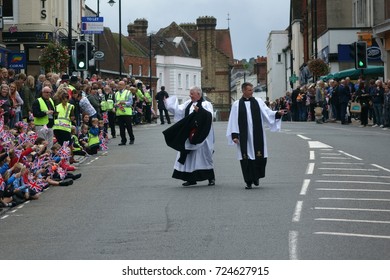 High Street, Dorking, Surrey, United Kingdom, 29 September 2017: A Reverend Gives A Joyful Wave To The Children At The Farewell Parade For Headley Court Defence Medical Rehabilitation Centre. 