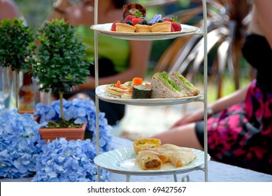 High Tea, Display Of A Selection Of Petit-fours, Canapes, Savories And Sandwiches At A Formal Luncheon English Tea Party