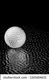 High Tech Golf Ball On Hammered Sheet Metal