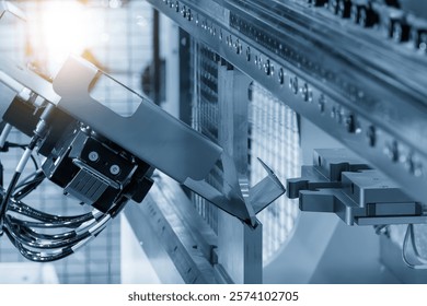 High technology bending machine  operation with robotic system in the light blue scene. The sheet metal working by automatic system.