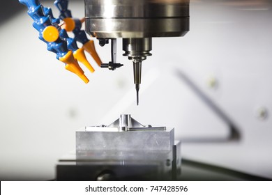 high technology CNC machining center, 5 axis machining, high speed cutting, high accuracy and precision production parts for automotive mold aerospace industrial - Powered by Shutterstock