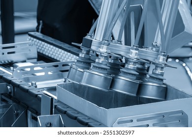 The high technology material handling process in canned food production by robotic system. The high technology material handling process by robotic arm. - Powered by Shutterstock