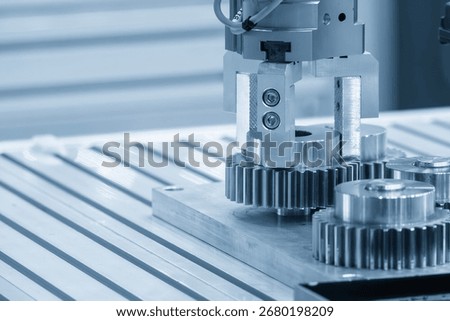 The high technology material handling process robotic system with metal gear parts in the blue tone. The logistic technology by robotic system.