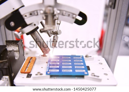 High technology and modern automatic robot for print circuit board (PCB)assembly machine during soldering or welding part or component at factory