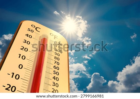High Temperature Thermometer Under Bright Sun and Blue Sky Concept