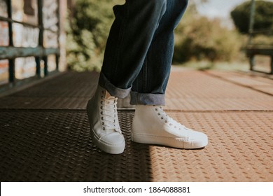High Top White Sneakers On Jeans Model