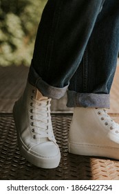 High Top White Sneakers On Jeans Model