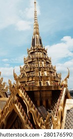 High Vertical Angle View Tall Gilded Ornate Thai Temple Spire With Intricate Detailed Carving