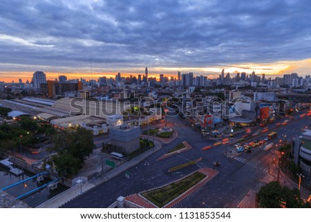 High view of city with traffic car in sunrise time / Good morning Bangkok