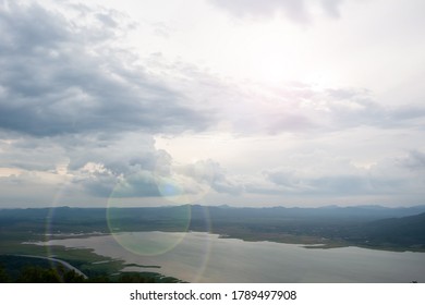 High view of cloudy sky with mountain and lake 