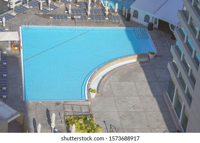 A High View Of The Empty Pool In The Hotel Complex.