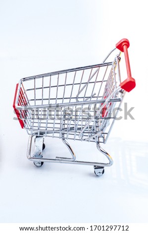 high view of empty shooping cart or troley isolated on white