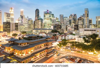 High View Of Singapore Skyline With Skyscrapers And Tooth Relic Temple At Blue Hour - World Famous Top South East Asia Destinations - City Panorama On Vivid Warm Filter With Nightscape Color Tones