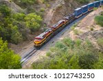 high view of a train going through the desert