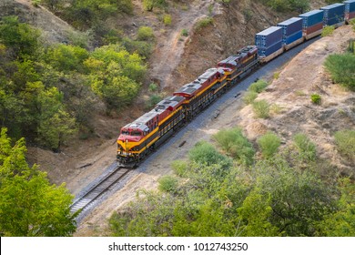 high view of a train going through the desert