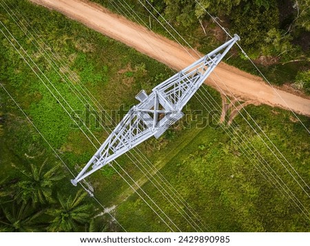High voltage aerial view. high voltage pole and the view of the natural, sunrise. High-angle, top view photography for industrial use electrical power systems.