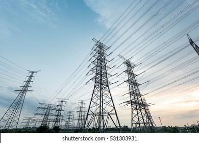 High voltage electric tower in the blue sky white cloud background