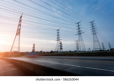 High voltage electric tower in the blue sky white cloud background