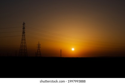 High Voltage Electric Tower On Sunrise Time . Africa . Egypt.