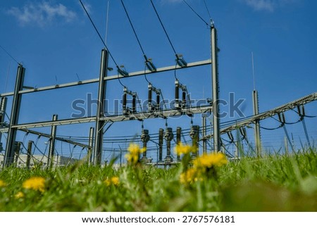 High voltage electrical substation with insulators and power lines in the Netherlands, energy grid infrastructure. Hoogspanningsstation Groningen Europark Tennet