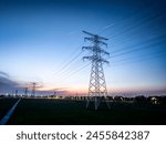 High voltage electricity tower landscape at sunset