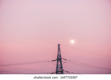 High voltage line over the beautiful pink sunset sky, copy space