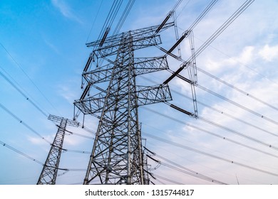 High voltage pole during sunset - Shutterstock ID 1315744817