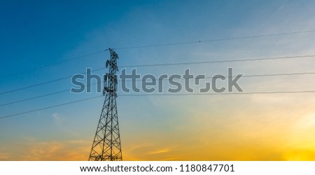 high voltage post,Electricity pylons and lines at sunset.