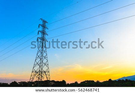 high voltage post,Electricity pylons and lines at sunset.